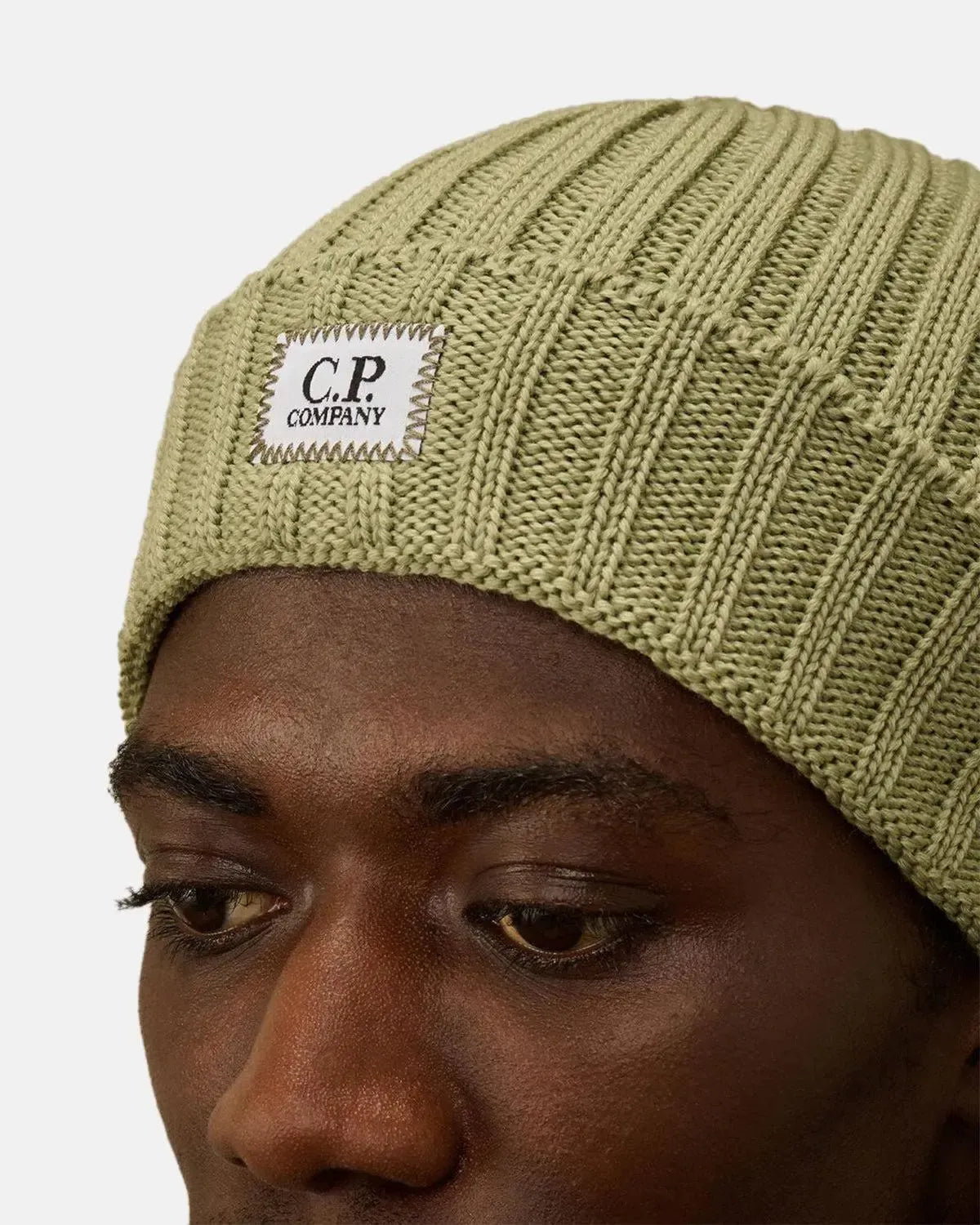 CP COMPANY-CP COMPANY EXTRA FINE MERINO WOOL LOGO BEANIE TEA GREEN-NORTHERN THREADS DESIGNER MENSWEAR